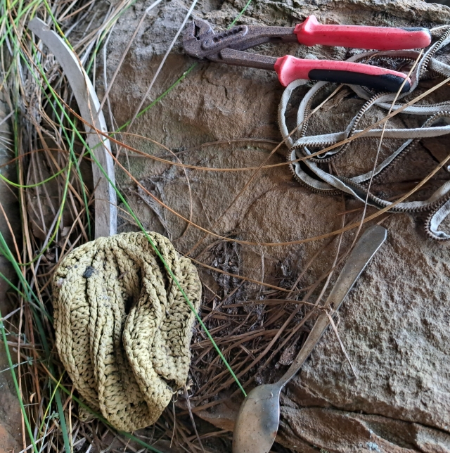 Pliers and spoon in cave above Kalk Bay