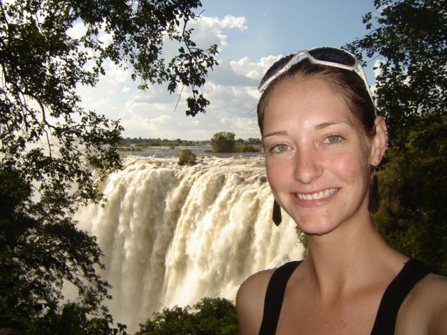 photo of person posing in front of Victoria Falls