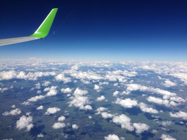 winglet of a Kulula B737-800 above the clouds