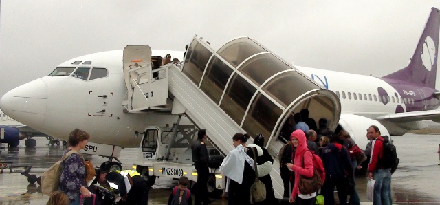 boarding a Velvet Sky airline plane