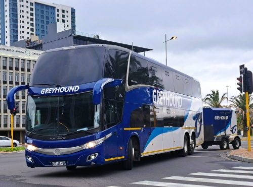 Greyhound double decker bus in Cape Town with trailer, turning off Hertzog Boulevard into Civic Avenue