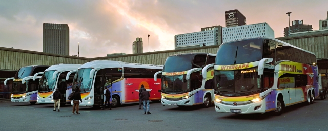 Five Intercape buses parked at Cape Town bus station, including a Marcopolo double decker sleepliner coach with a Pretoria sign on it