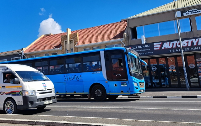 Sibanye bus next to a minibus taxi in Goodwood, Cape Town