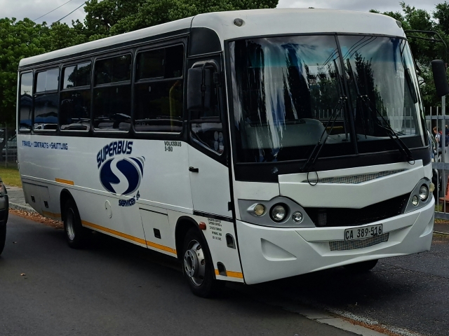 Superbus bus parked on a pavement