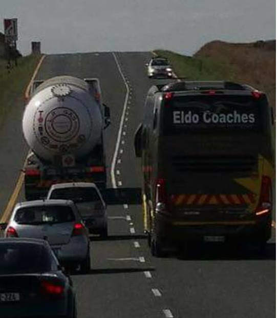 Eldo Coaches bus overtaking vehicles in the face of oncoming traffic
