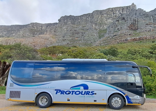 Pro Tours bus with Table Mountain in the background