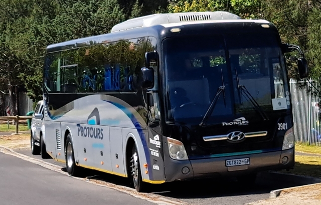 Protours bus parked outside Pinelands High School in Cape Town