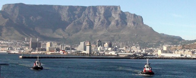 tugboats approaching the MSC Melody in Cape Town