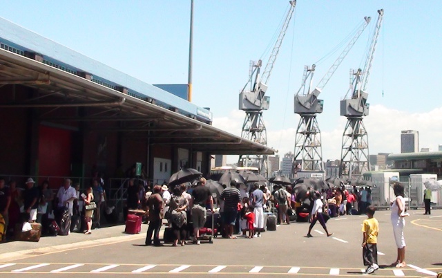 queue for boarding the MSC Sinfonia in Durban, South Africa