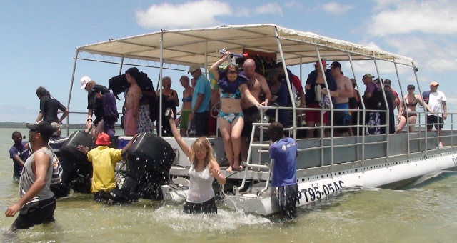 snorkellers getting off boat at Portuguese Island