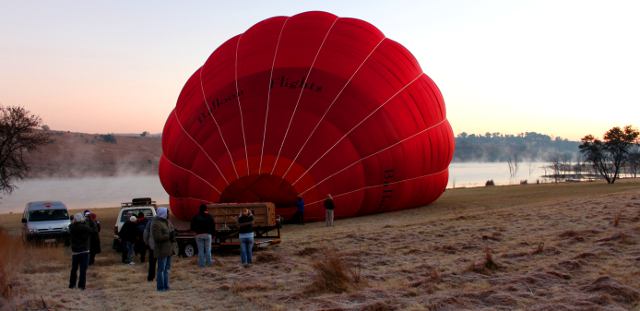 hot air balloon being filled in the early morning frost at Lake Heritage