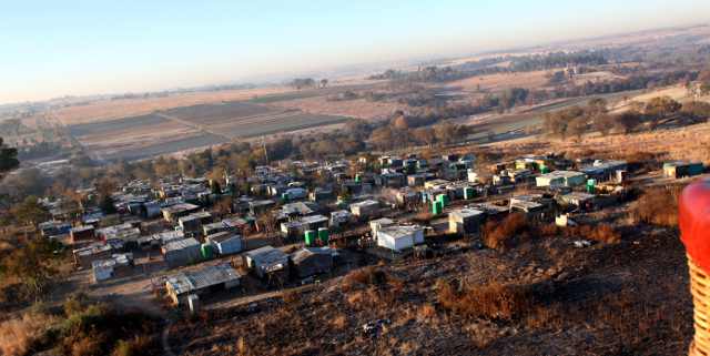 hot air ballooning over a township in South Africa