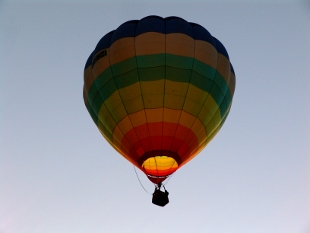 hot air balloon rising into the skies