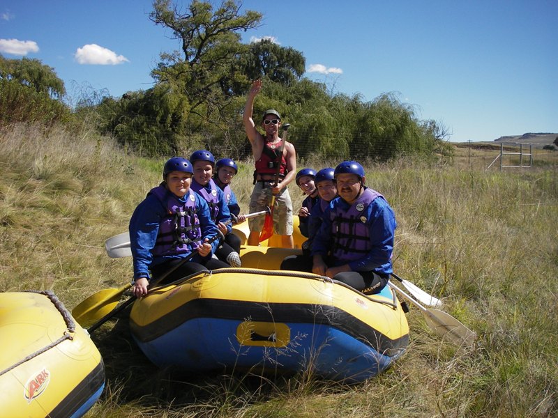 white water rafting photo - in the boat on land
